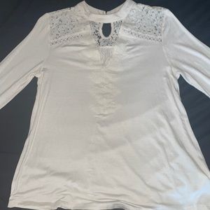 A very sexy cream colored long sleeved lace shoulders and upper back